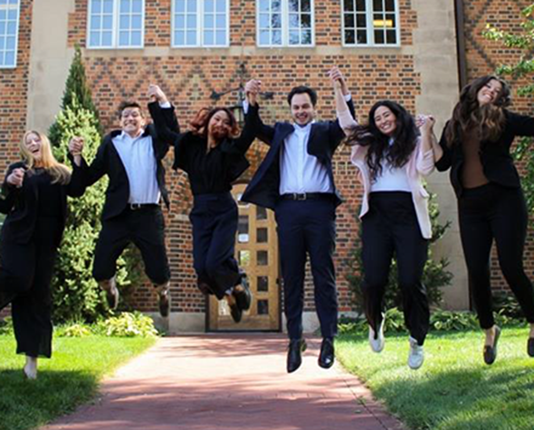 group photo of CEDC student attorneys jumping in the air