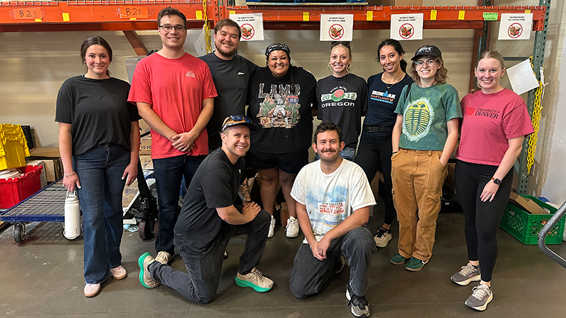 group photo of students in warehouse