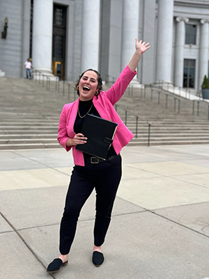 Carly Regal in front of Denver courthouse steps