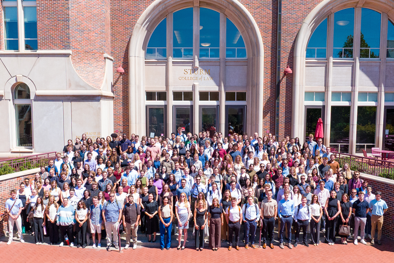 Group photo of incoming students on steps of law school